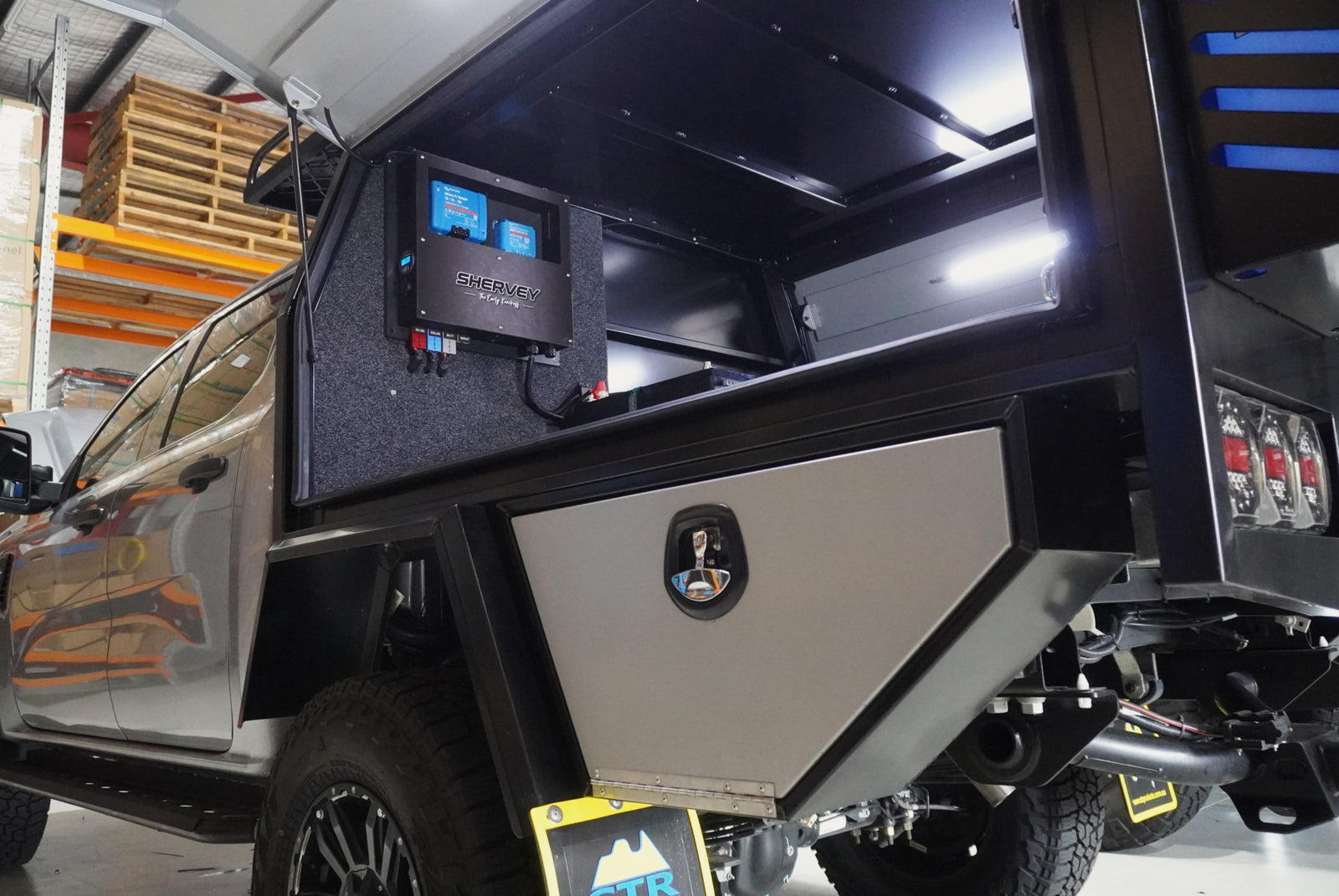 Custom off-grid solar power setup installed in 4WD canopy with Victron battery and control system